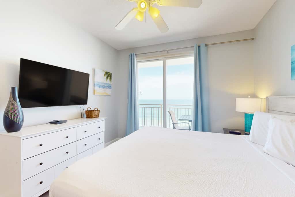 Tropical-themed condo with bi-level pool, fitness center & beach access