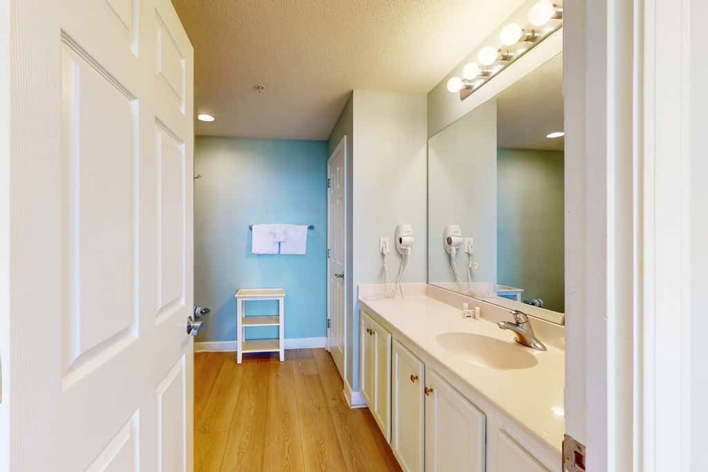 Tropical-themed condo with bi-level pool, fitness center & beach access