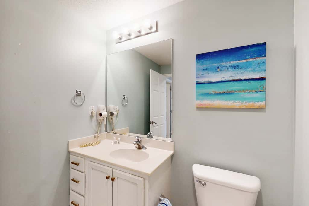 Tropical-themed condo with bi-level pool, fitness center & beach access