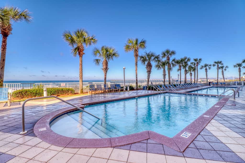 Tropical-themed condo with bi-level pool, fitness center & beach access
