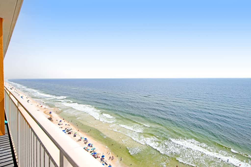 Colorful, beachfront condo with Gulf view, pool, hot tub, and lazy river