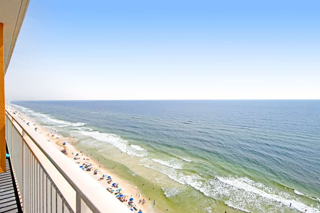Colorful, beachfront condo with Gulf view, pool, hot tub, and lazy river