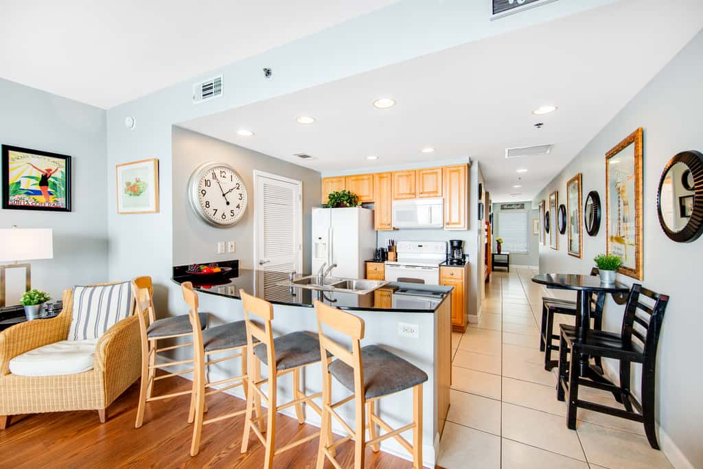 Colorful, beachfront condo with Gulf view, pool, hot tub, and lazy river