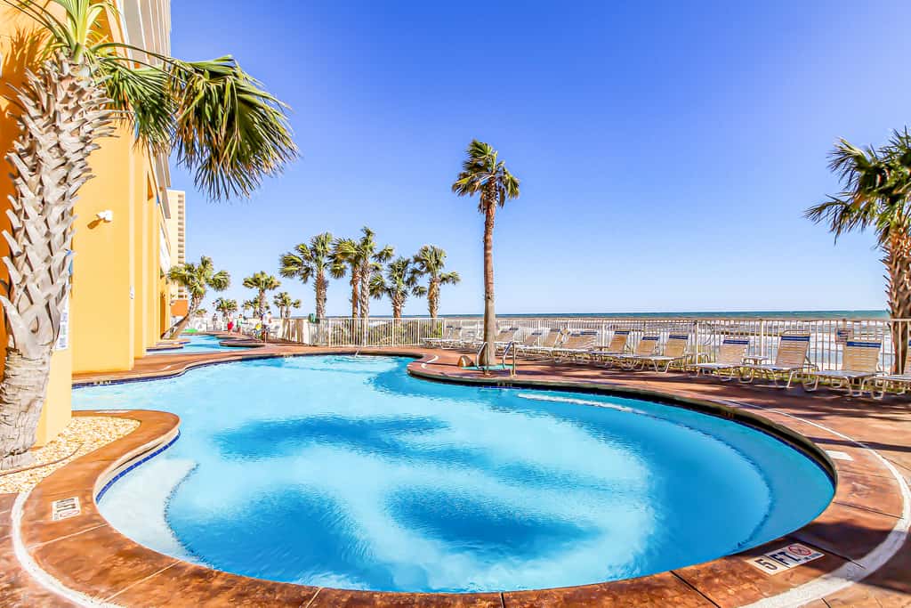 Colorful, beachfront condo with Gulf view, pool, hot tub, and lazy river