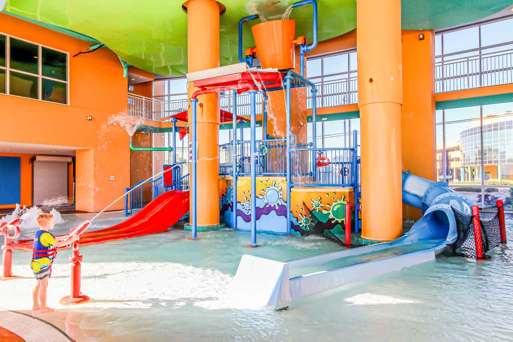 Colorful, beachfront condo with Gulf view, pool, hot tub, and lazy river