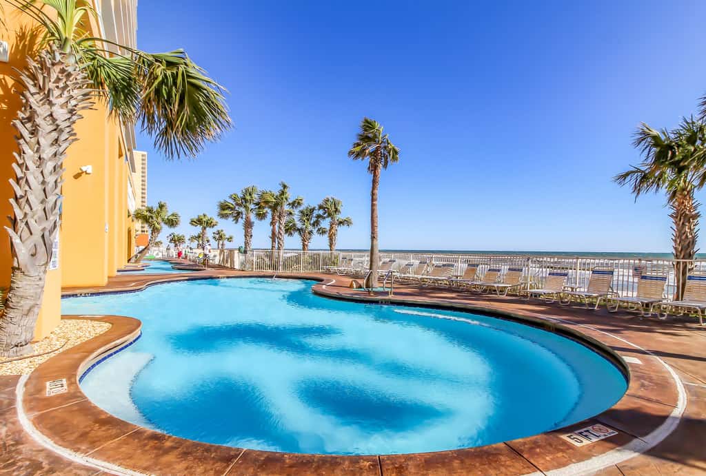 Stylish Gulf-front condo steps from the beach with resort pool, hot tub & gym