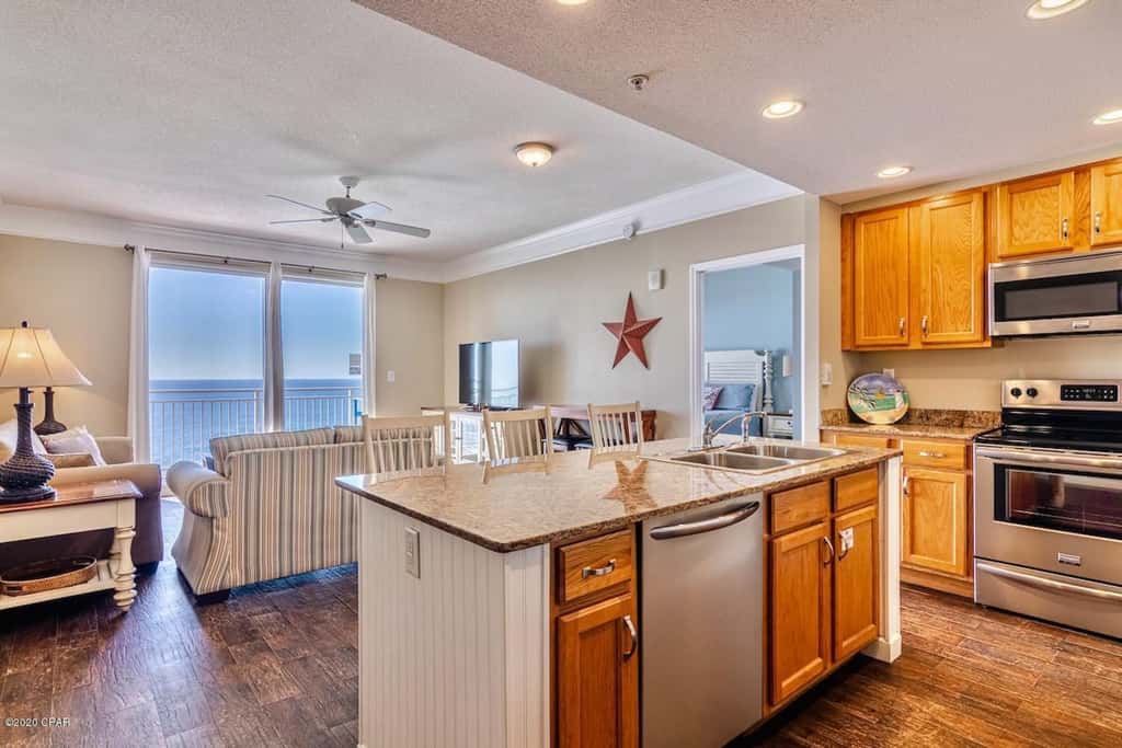 Gulf-front condo with pier views, balcony, heated pool, gym & AC