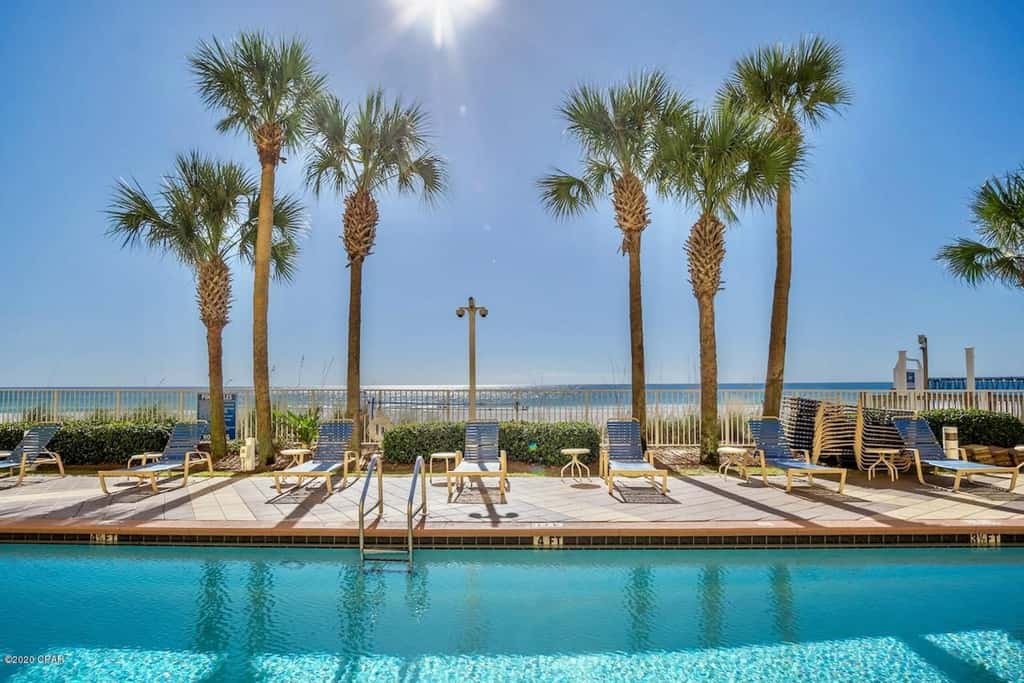 Gulf-front condo with pier views, balcony, heated pool, gym & AC