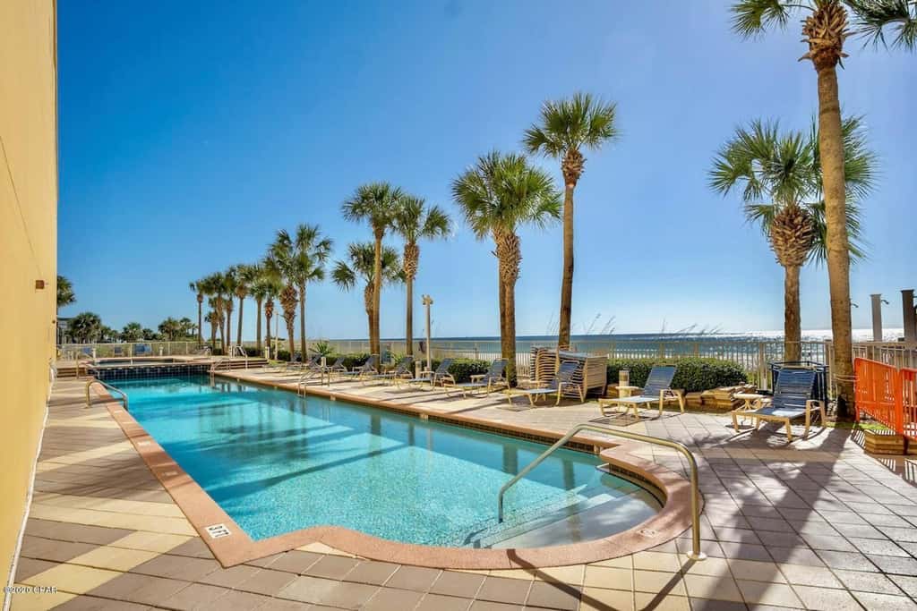 Gulf-front condo with pier views, balcony, heated pool, gym & AC