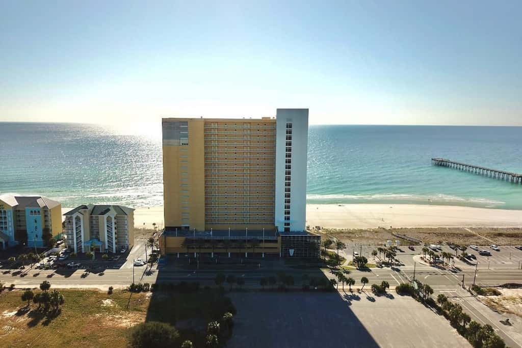 Gulf-front condo with pier views, balcony, heated pool, gym & AC