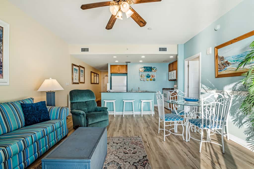 Snow-bird friendly condo with pool & fitness room - walk right out to the sand