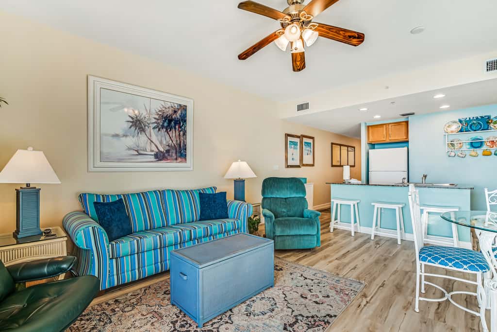 Snow-bird friendly condo with pool & fitness room - walk right out to the sand