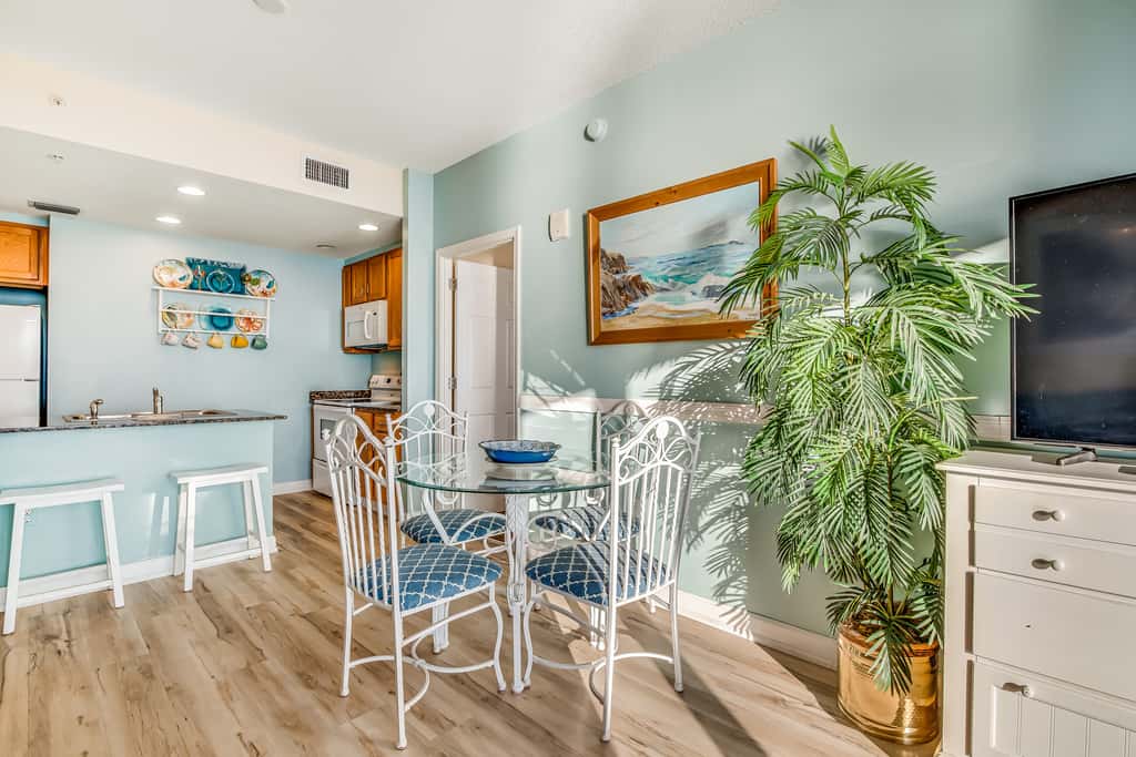 Snow-bird friendly condo with pool & fitness room - walk right out to the sand