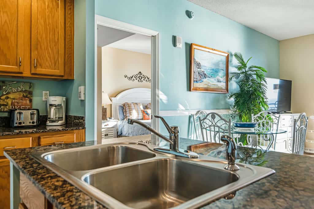 Snow-bird friendly condo with pool & fitness room - walk right out to the sand