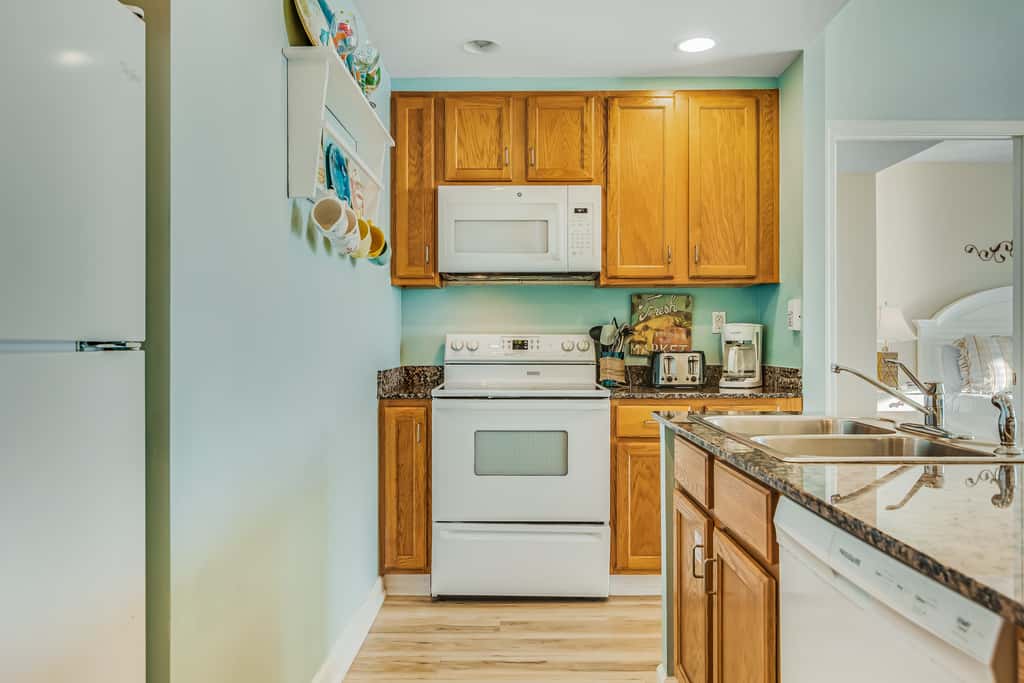 Snow-bird friendly condo with pool & fitness room - walk right out to the sand