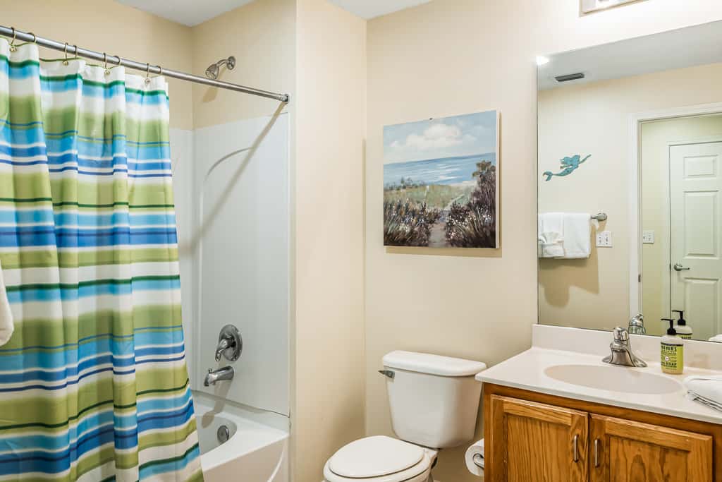 Snow-bird friendly condo with pool & fitness room - walk right out to the sand