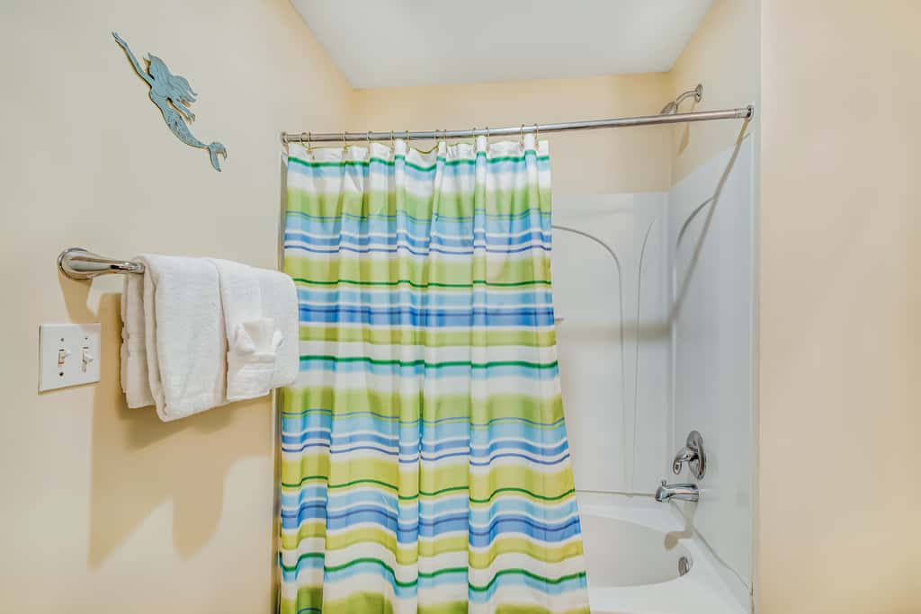 Snow-bird friendly condo with pool & fitness room - walk right out to the sand