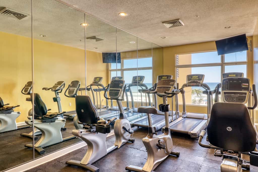 Snow-bird friendly condo with pool & fitness room - walk right out to the sand