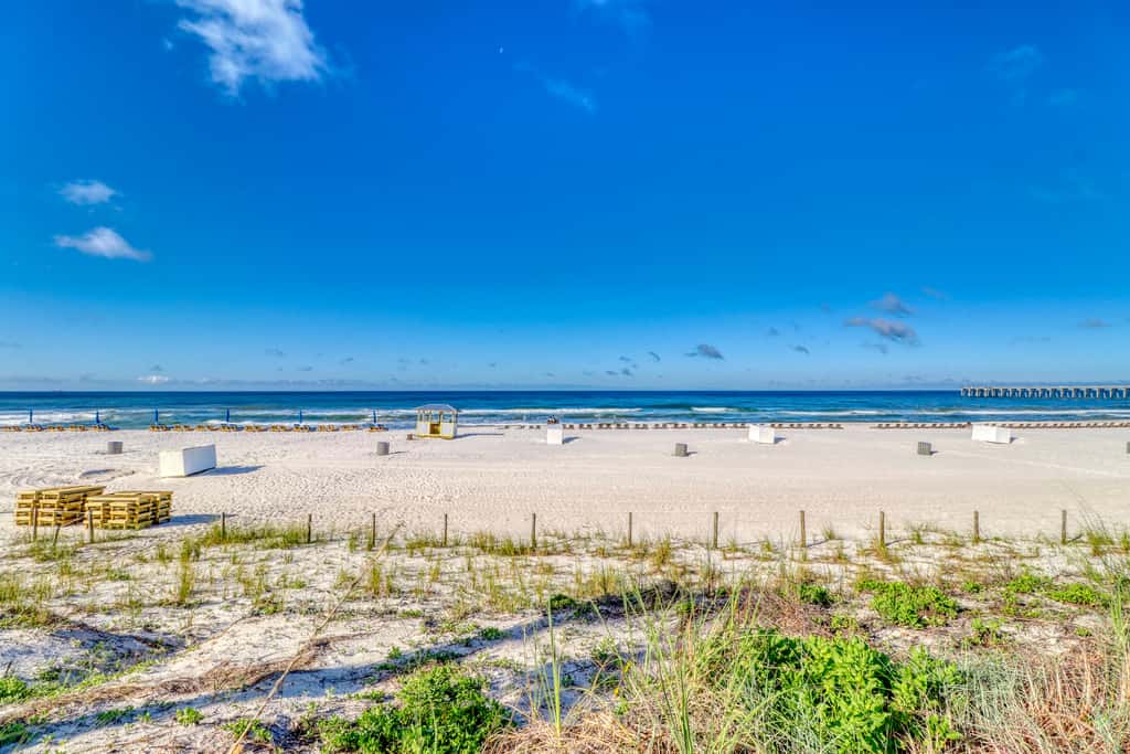 Snow-bird friendly condo with pool & fitness room - walk right out to the sand