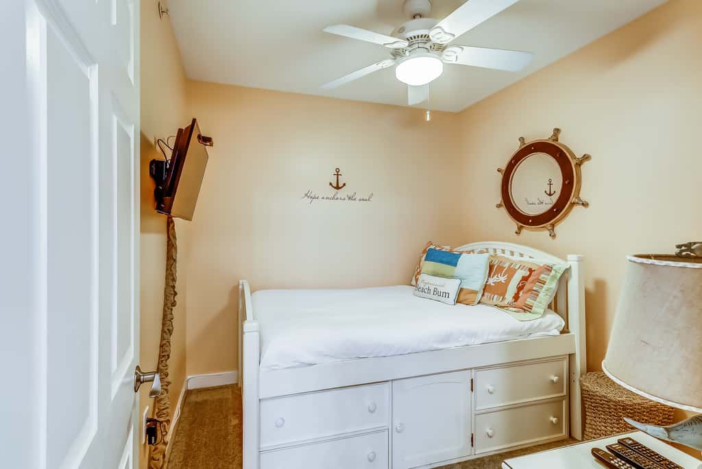 Serene & upscale beachfront condo with furnished balcony, view, & pools