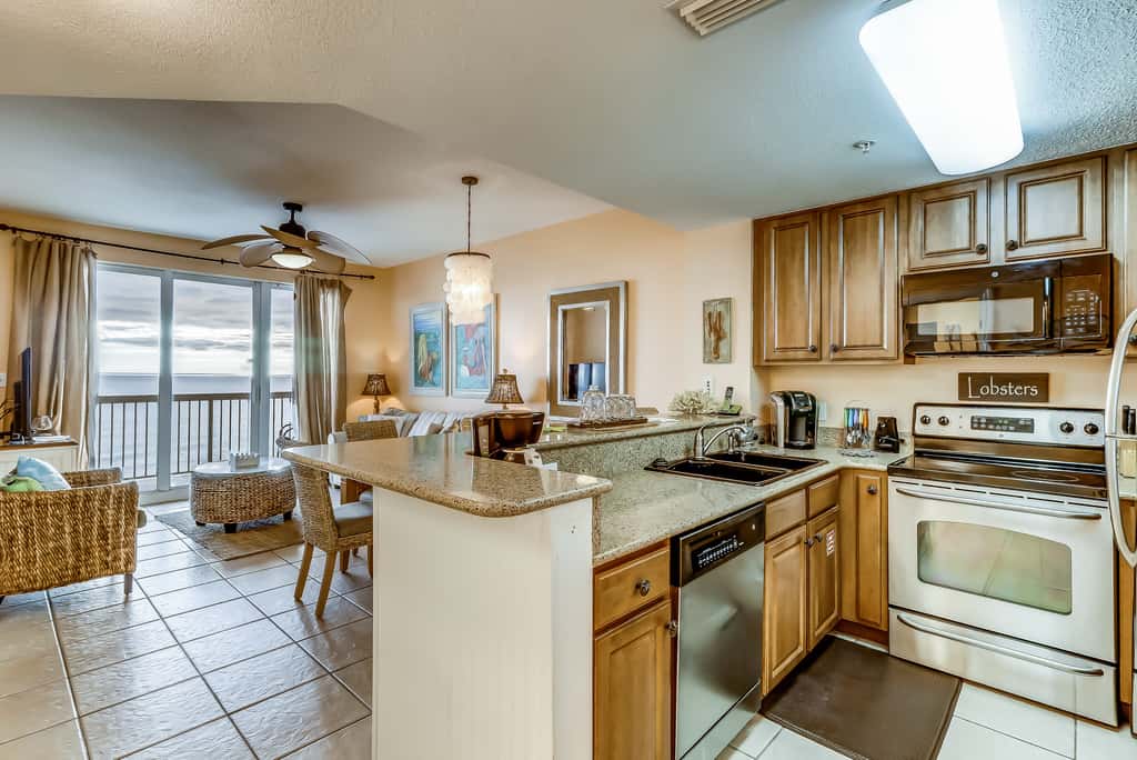 Serene & upscale beachfront condo with furnished balcony, view, & pools