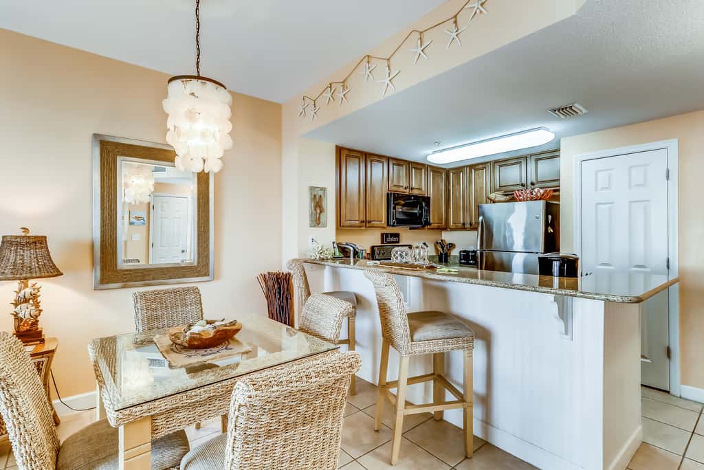 Serene & upscale beachfront condo with furnished balcony, view, & pools