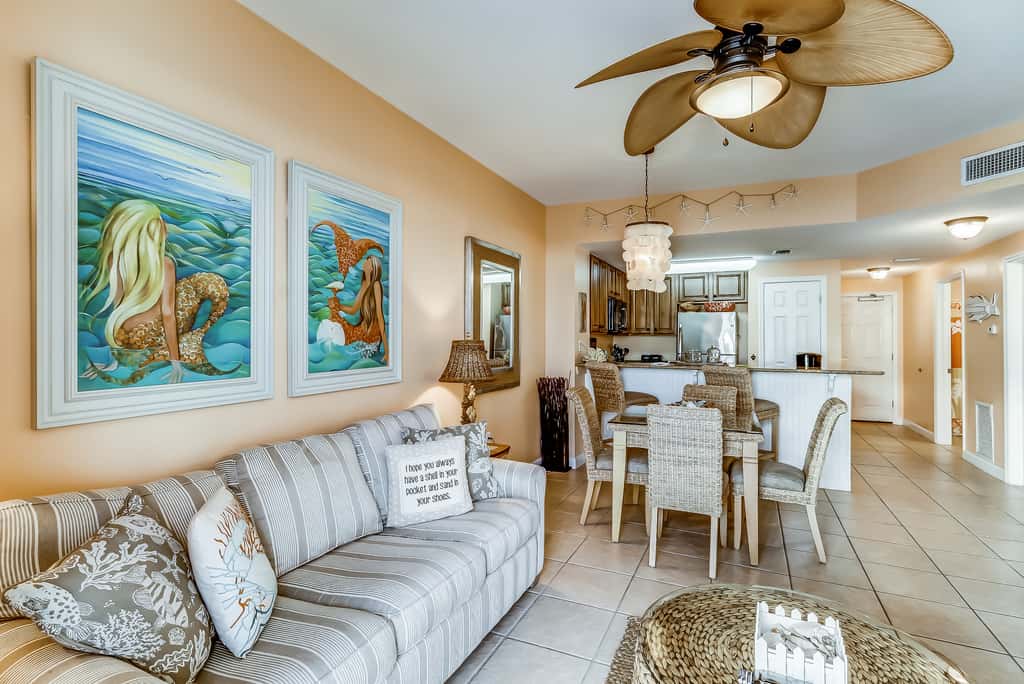 Serene & upscale beachfront condo with furnished balcony, view, & pools