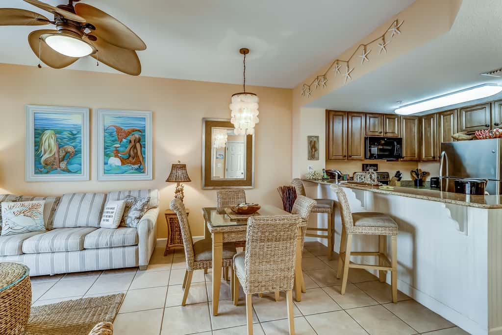 Serene & upscale beachfront condo with furnished balcony, view, & pools