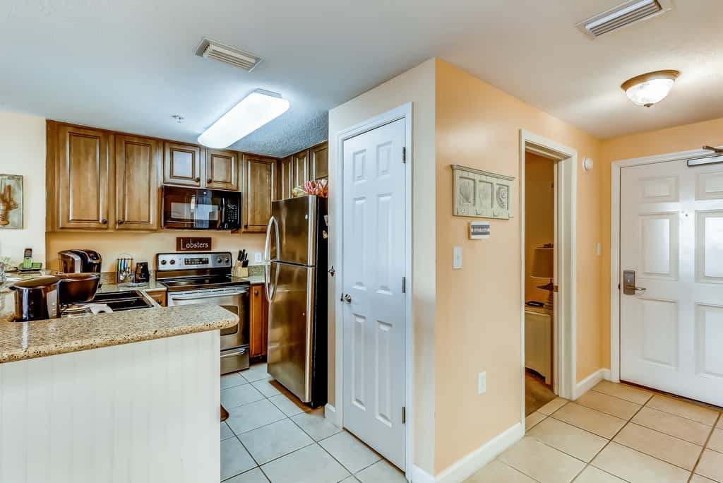 Serene & upscale beachfront condo with furnished balcony, view, & pools