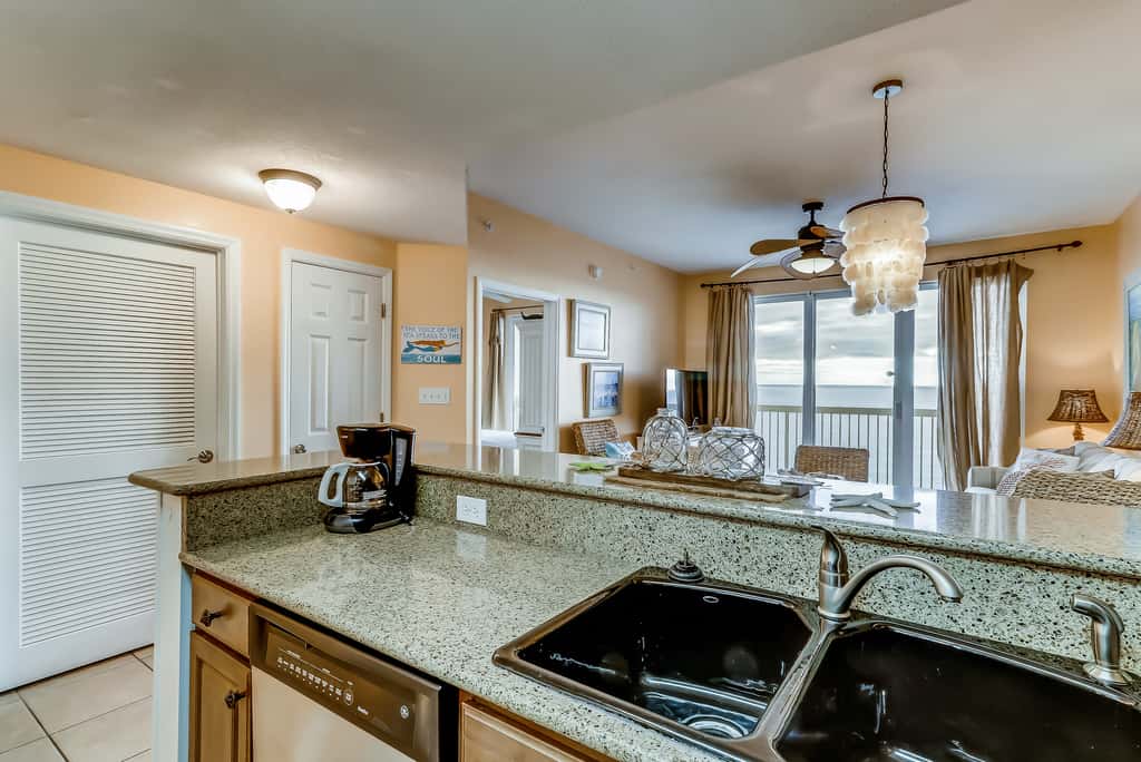 Serene & upscale beachfront condo with furnished balcony, view, & pools