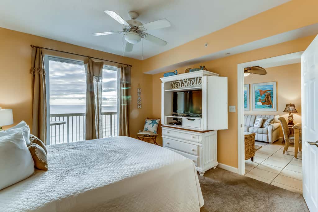 Serene & upscale beachfront condo with furnished balcony, view, & pools