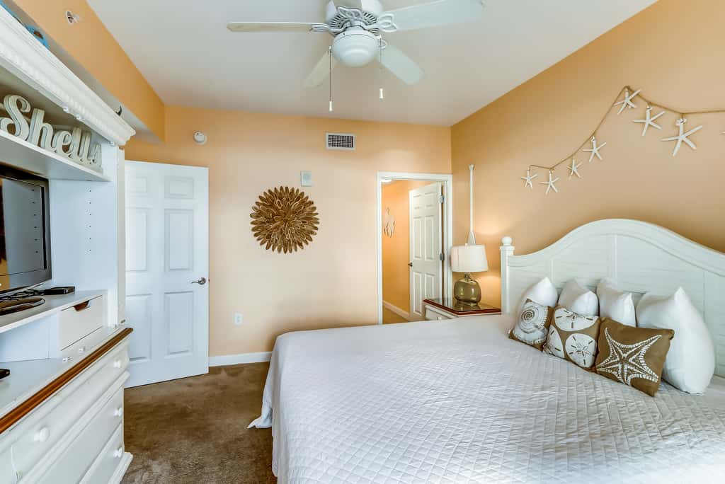 Serene & upscale beachfront condo with furnished balcony, view, & pools