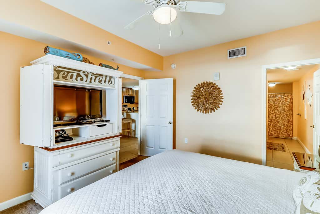 Serene & upscale beachfront condo with furnished balcony, view, & pools