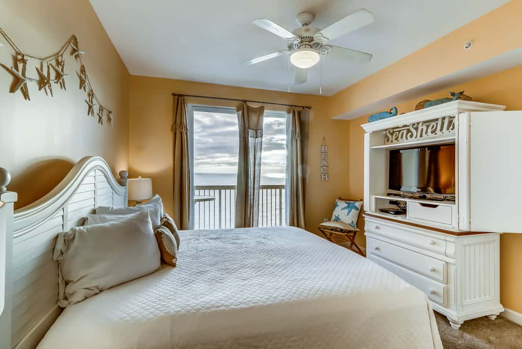 Serene & upscale beachfront condo with furnished balcony, view, & pools