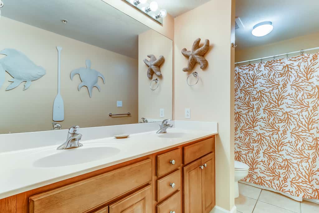 Serene & upscale beachfront condo with furnished balcony, view, & pools