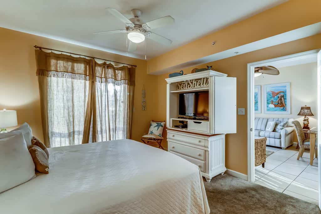 Serene & upscale beachfront condo with furnished balcony, view, & pools