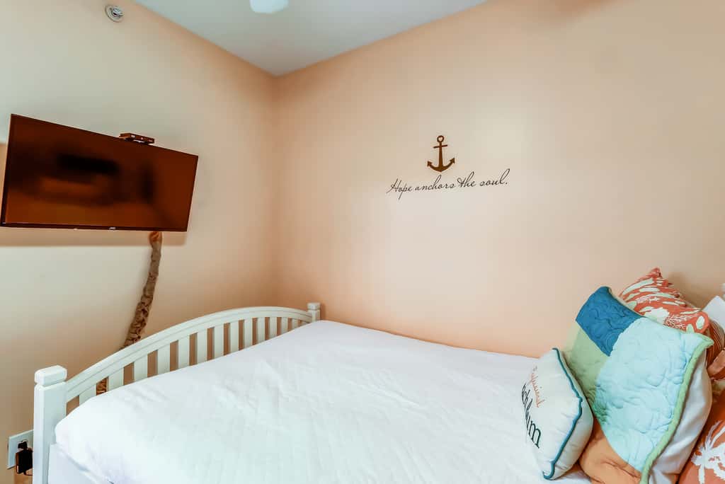 Serene & upscale beachfront condo with furnished balcony, view, & pools