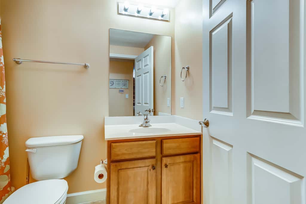 Serene & upscale beachfront condo with furnished balcony, view, & pools