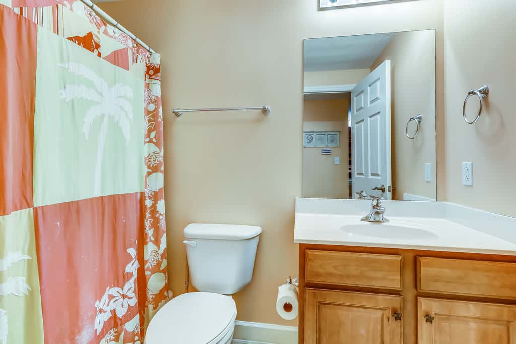 Serene & upscale beachfront condo with furnished balcony, view, & pools