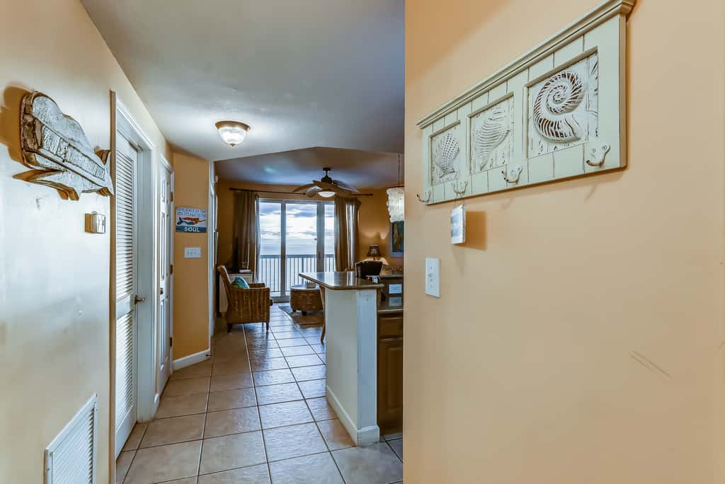 Serene & upscale beachfront condo with furnished balcony, view, & pools