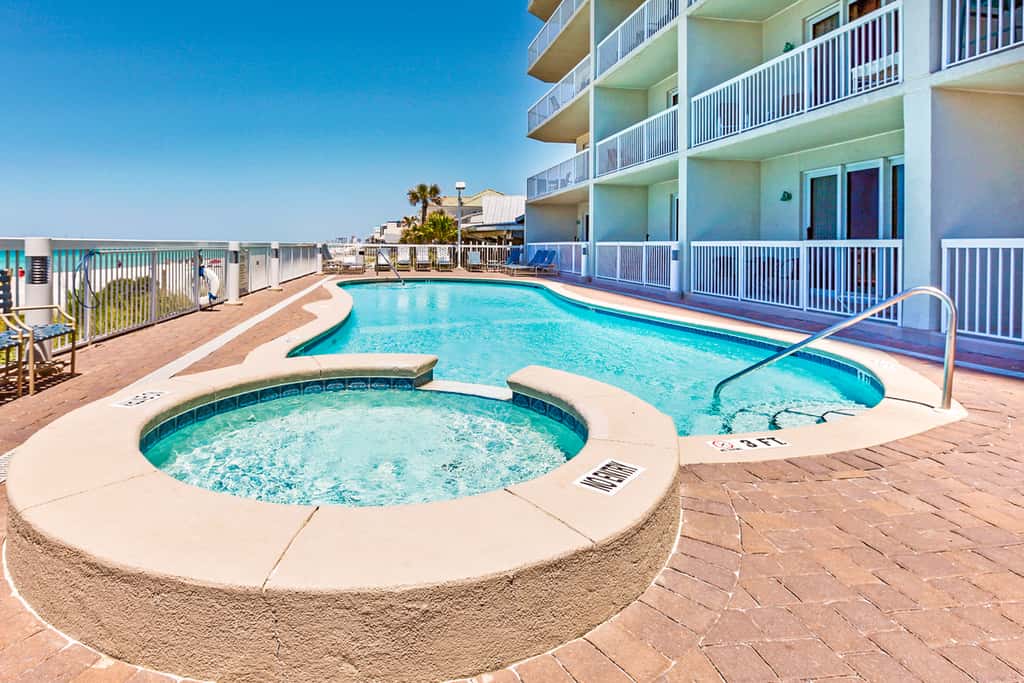 Cool & contemporary beachfront getaway with large balcony, pools, & gym