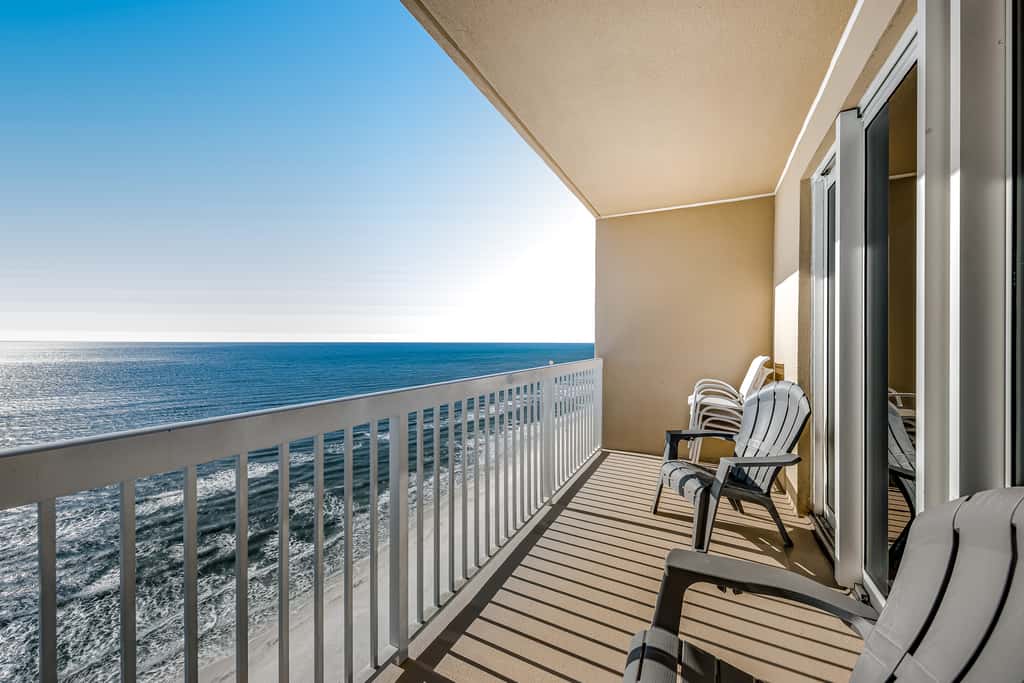 Tropical, waterfront oasis with furnished balcony, pools, & beach access