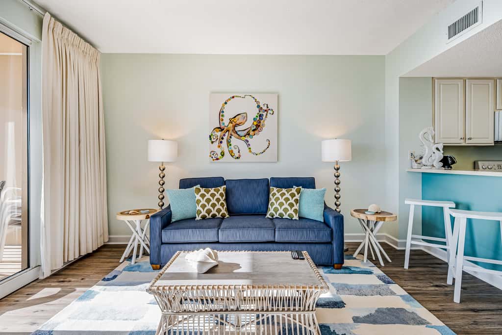 Tropical, waterfront oasis with furnished balcony, pools, & beach access