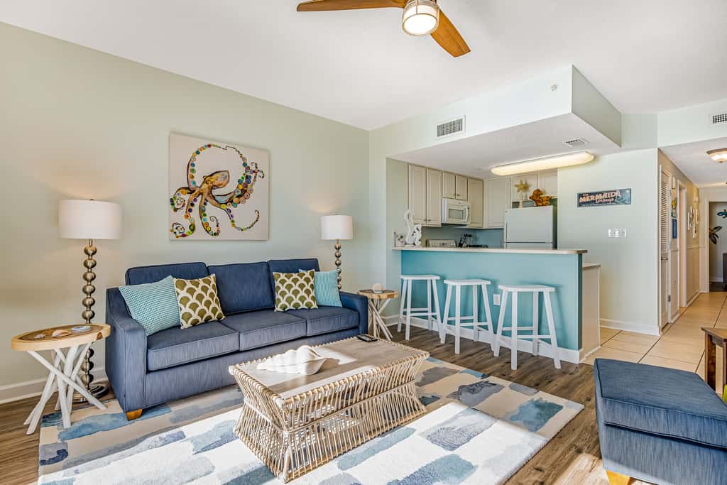 Tropical, waterfront oasis with furnished balcony, pools, & beach access