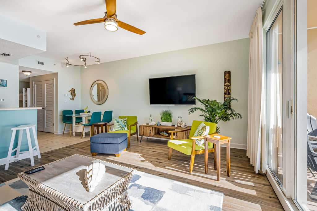 Tropical, waterfront oasis with furnished balcony, pools, & beach access