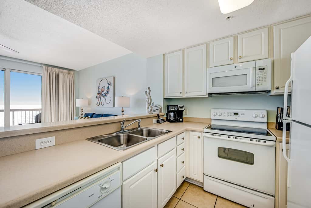 Tropical, waterfront oasis with furnished balcony, pools, & beach access