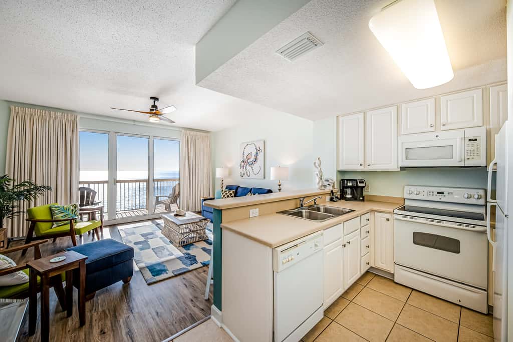 Tropical, waterfront oasis with furnished balcony, pools, & beach access