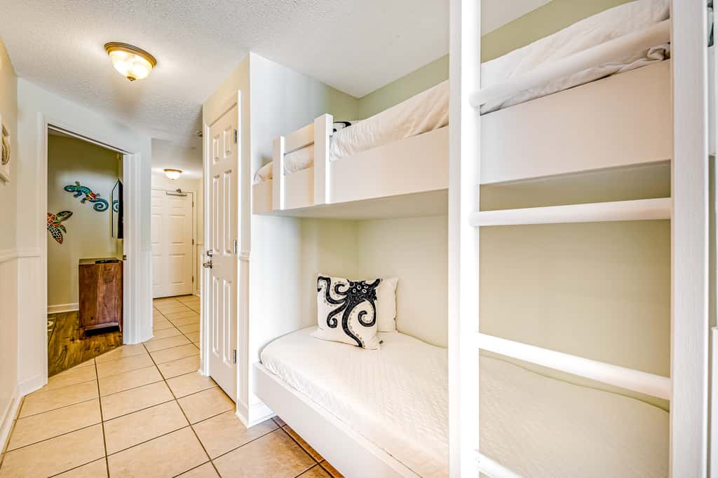Tropical, waterfront oasis with furnished balcony, pools, & beach access