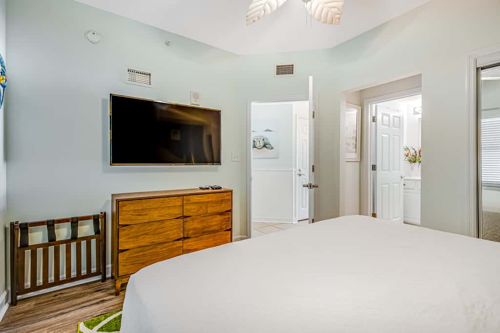 Tropical, waterfront oasis with furnished balcony, pools, & beach access