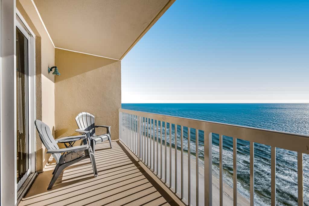 Tropical, waterfront oasis with furnished balcony, pools, & beach access